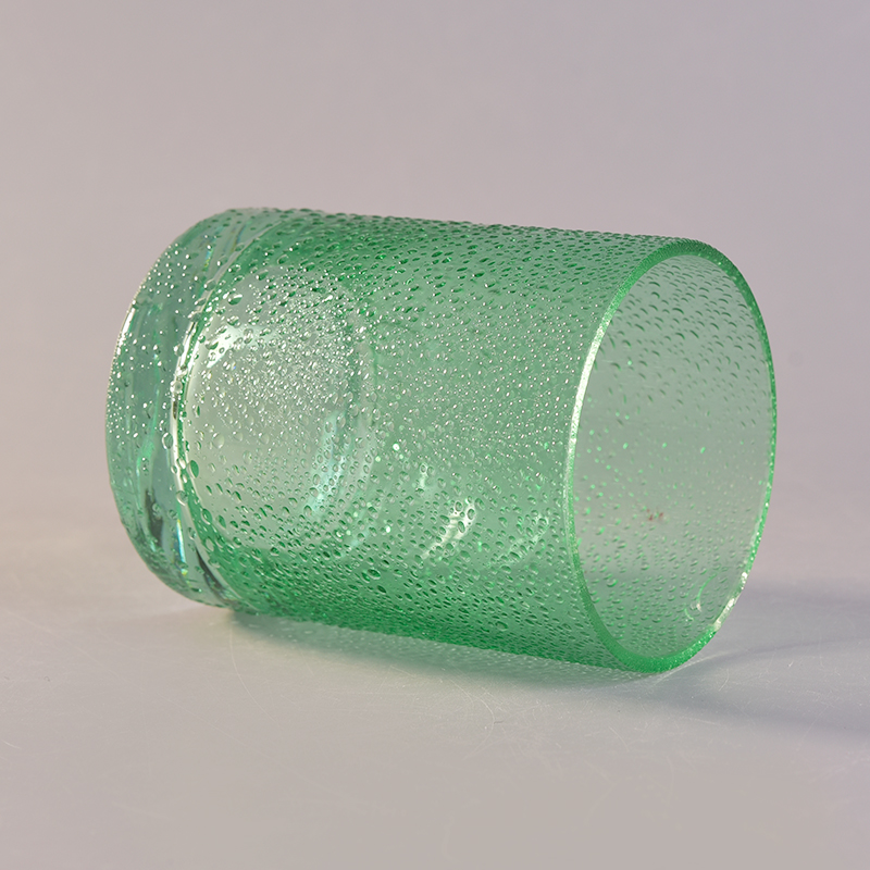 Green round straight-sided glass candle holder with rain drops effect