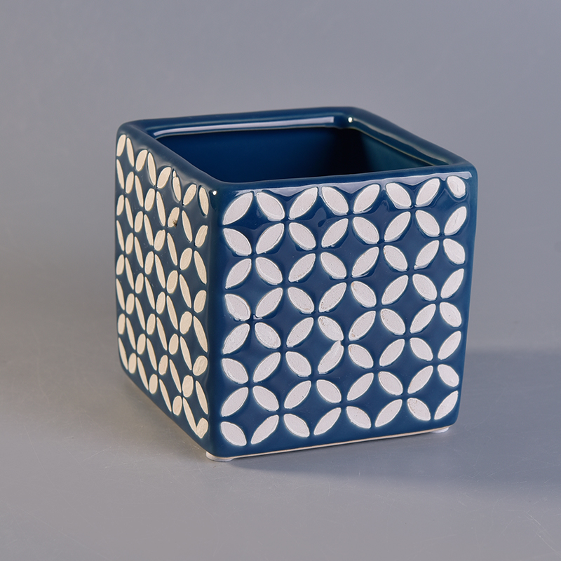 blue ceramic candle jar with white printing pattern