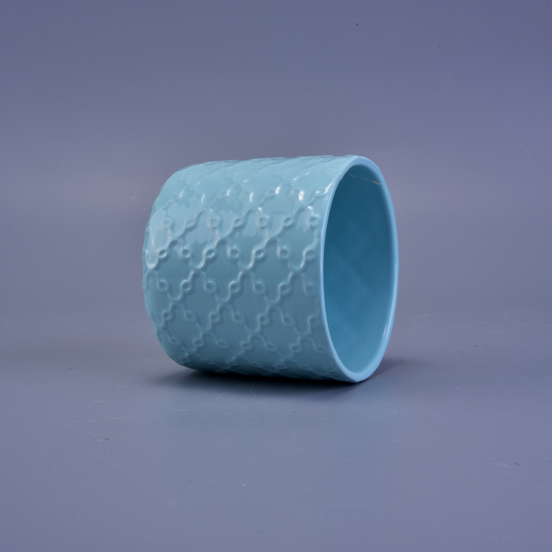 Blue matte ceramic candle holder with embossed pattern