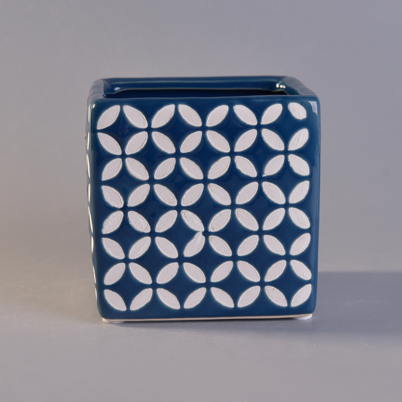 blue ceramic candle jar with white printing pattern