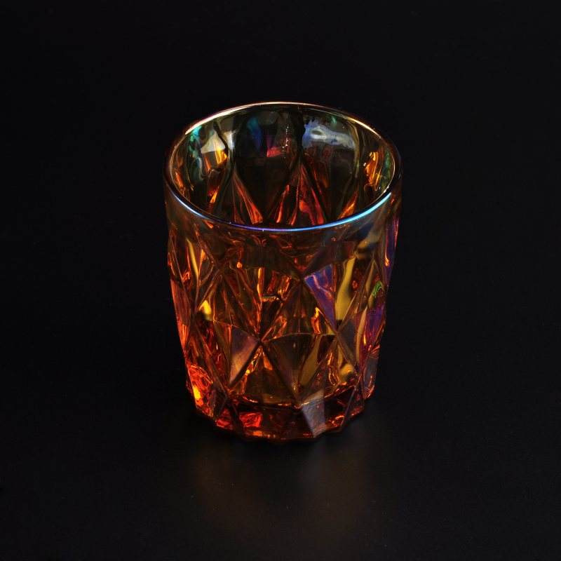 Iridescent glass candle holder with diamond-shaped pattern surface