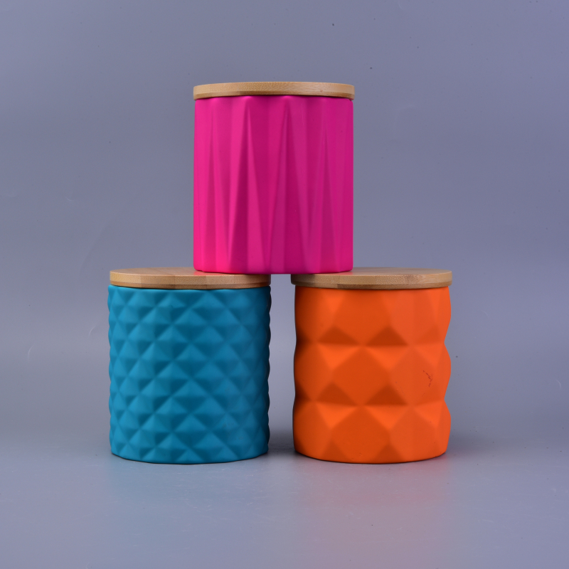 bright-colored ceramic jars for candles with wood lid