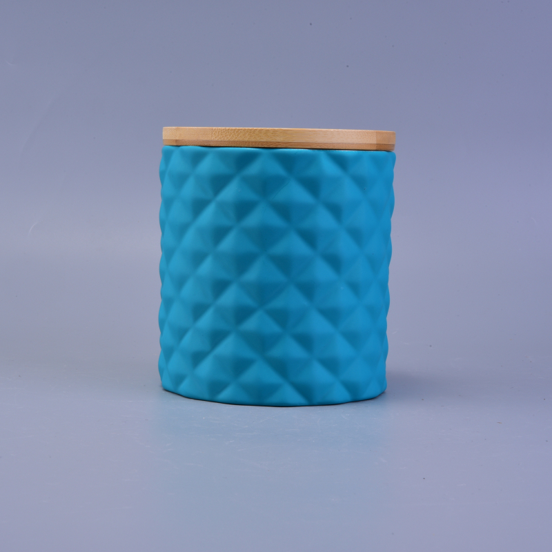 bright-colored ceramic jars for candles with wood lid