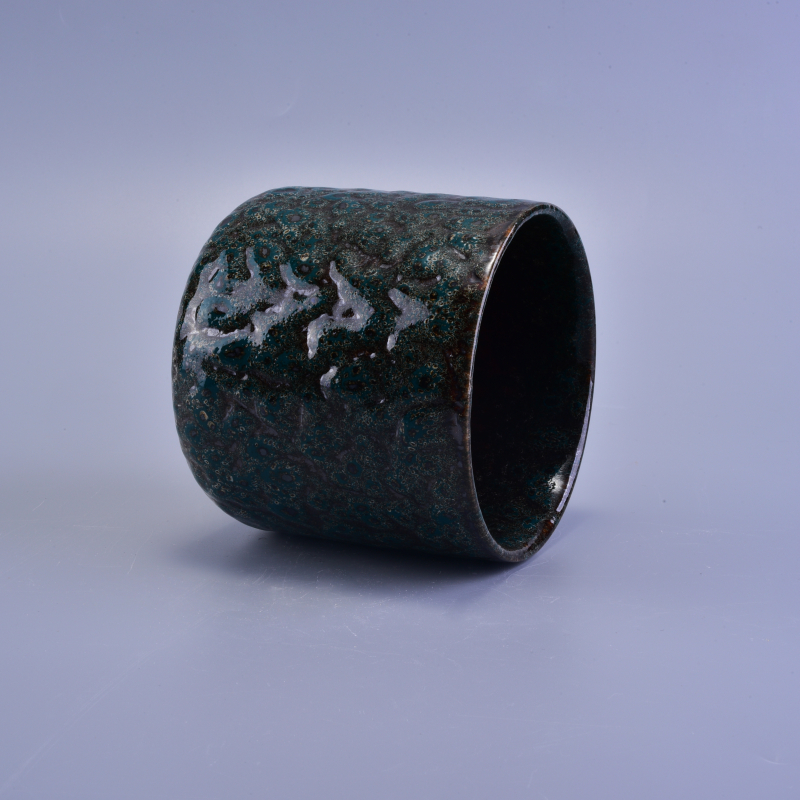 Black ceramic candle vessel with relief surface