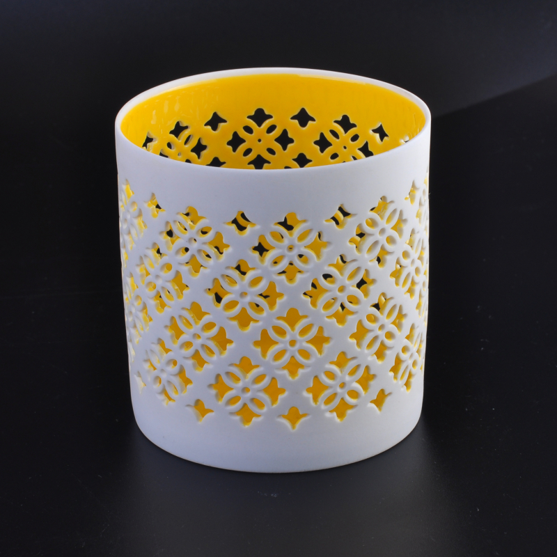 White hollow-out ceramic candle holder vessel flower pattern yellow inner 