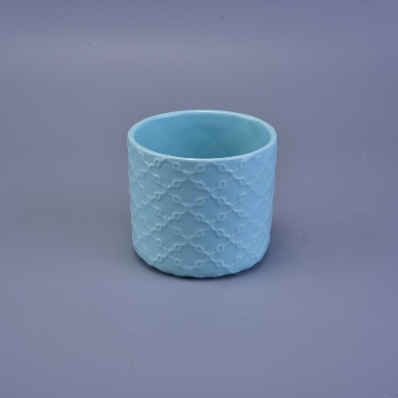 Blue matte ceramic candle holder with embossed pattern