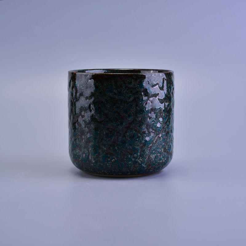 Black ceramic candle vessel with relief surface