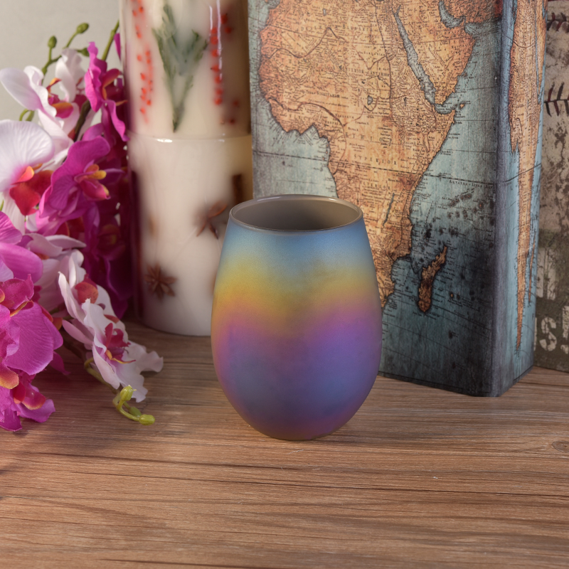 Oval iridescent glass candle vessel