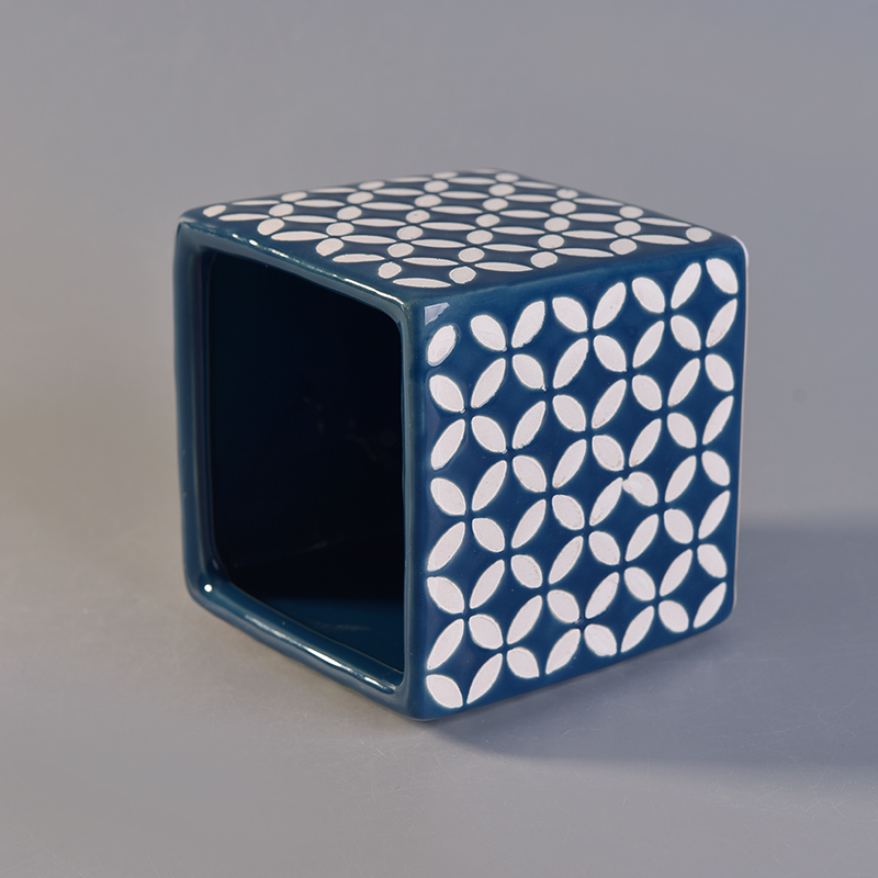 blue ceramic candle jar with white printing pattern