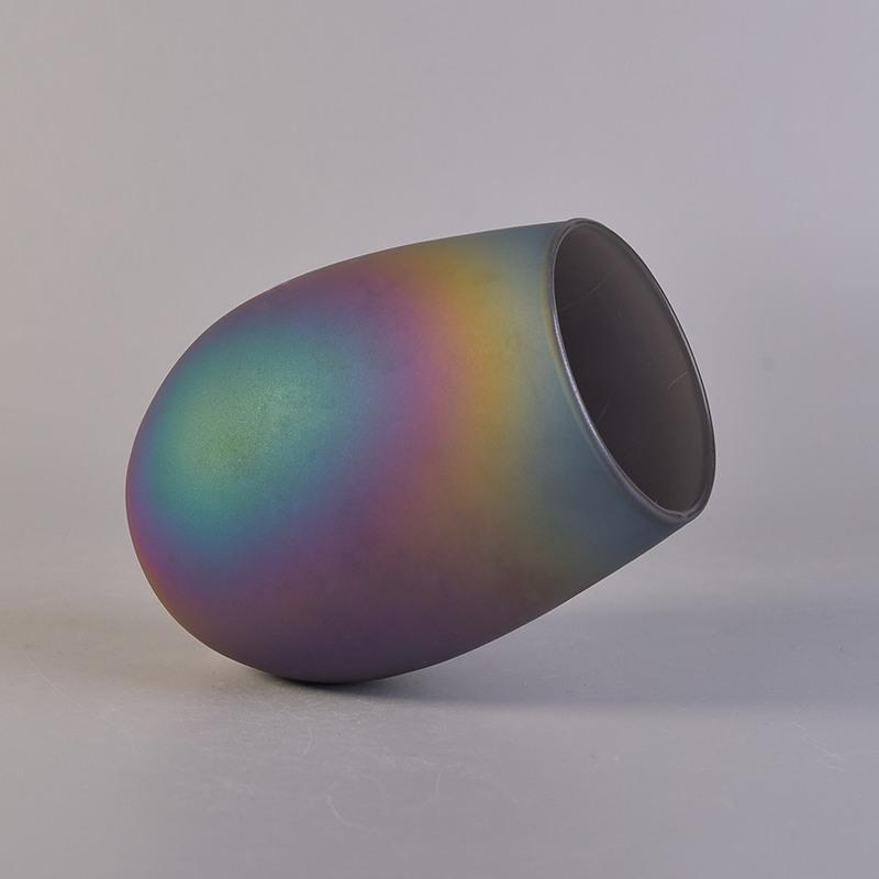 Oval iridescent glass candle vessel