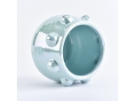 Blue ceramic candle jar with iridescent effect glaze finish