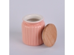 Orange glossy ceramic candle jar with wooden lid