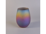 Oval iridescent glass candle vessel