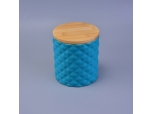 blue ceramic candle holder with diamond-shaped pattern surface