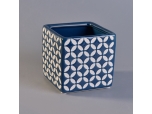 blue ceramic candle jar with white printing pattern