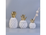 white pineapple shape ceramic jar with gold lid